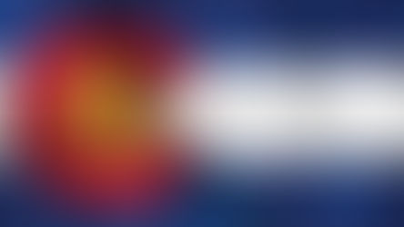 Colorado flag design featuring a fetus inside the "C" shape, with various joyful people in the background, creating a hopeful mood.