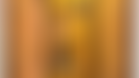 Monk kneels beside building, gazing at six-winged seraph on the cross. Icon has vibrant gold, orange, and black hues. Spiritual aura.
