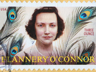 USA stamp featuring a woman with peacock feathers in the background. Text: "FLANNERY O'CONNOR, THREE OUNCE." Vibrant colors.