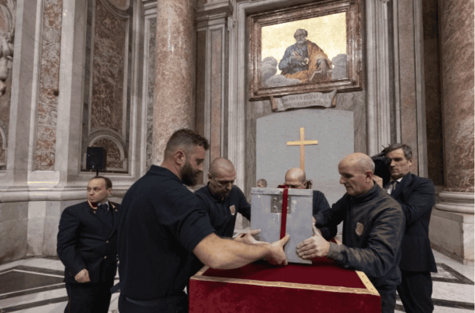 The metal box is removed from inside the wall. (Photo: Vatican Media)
