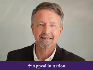 Smiling man in a suit against a neutral background. Text: "Appeal in Action" on a purple banner below. Mood is professional and friendly.