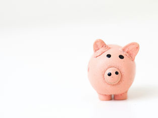 Pink piggy bank on a white background. The simple, minimalist design suggests saving and financial management.