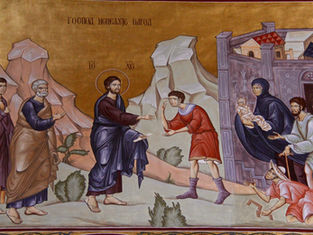 Ancient mural depicting a haloed figure extending a hand to a man in red. Others watch nearby. Text in Cyrillic above. Earthy tones.