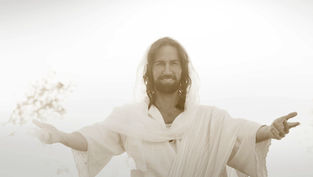Man with open arms and a serene smile, wearing a white robe, in a bright, soft-focus setting. Peaceful and inviting mood.