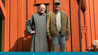 Two smiling men pose in front of an orange wooden building. One wears a gray robe, the other a brown jacket. Text: Appeal in Action.