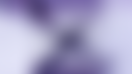 A purple powdery "X" on a white surface, with a metal tin lid nearby. The image has a soft purple gradient, creating a mysterious mood.