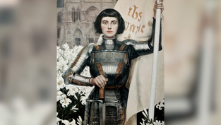A person in armor holds a flag reading "Jesus Maria" amid white lilies with a gothic building behind. Serious expression, historical vibe.