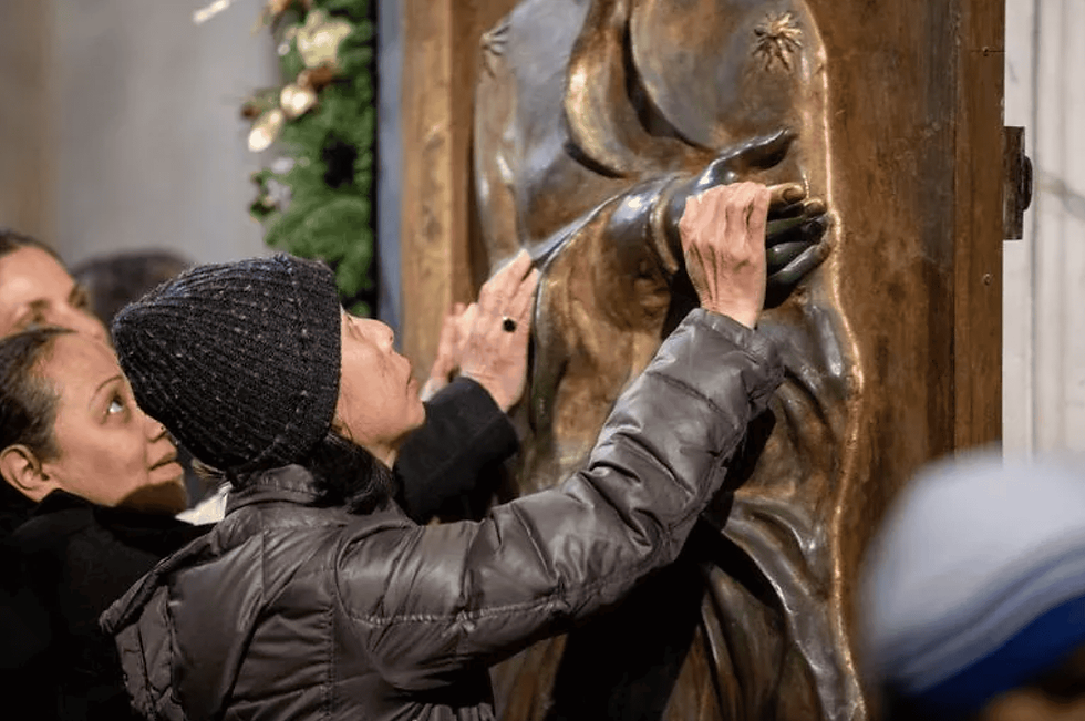 Pilgrims from all over the world passing through the Holy Door of the Basilica of St. Mary Major on Jan. 1, 2025. (Photo: Daniel Ibanez / EWTN)