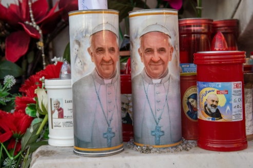 Candles with Pope Francis’ image on them stand outside Gemelli Hospital in Rome on Feb. 21, 2025. (Photo: Daniel Ibañez/CNA)