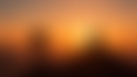 Hiker with a backpack approaches a meditating person on a mountain peak at sunset. Silhouetted against an orange sky with distant hills.