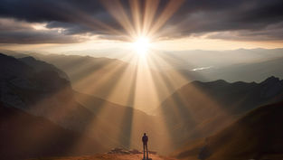 A person stands on a mountain peak at sunset, with sunbeams breaking through clouds. Majestic landscape, warm colors create a serene mood.
