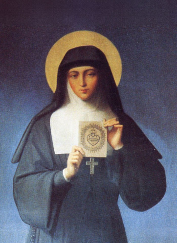 Portrait of a nun in a black habit with a golden halo, holding a religious image against a blue background, serene and solemn