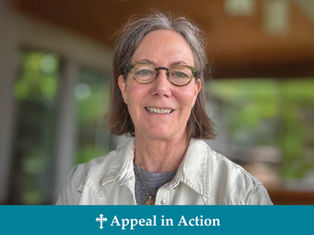Smiling person with glasses and short hair, wearing a white shirt. Blurred green background. Text reads "Appeal in Action."