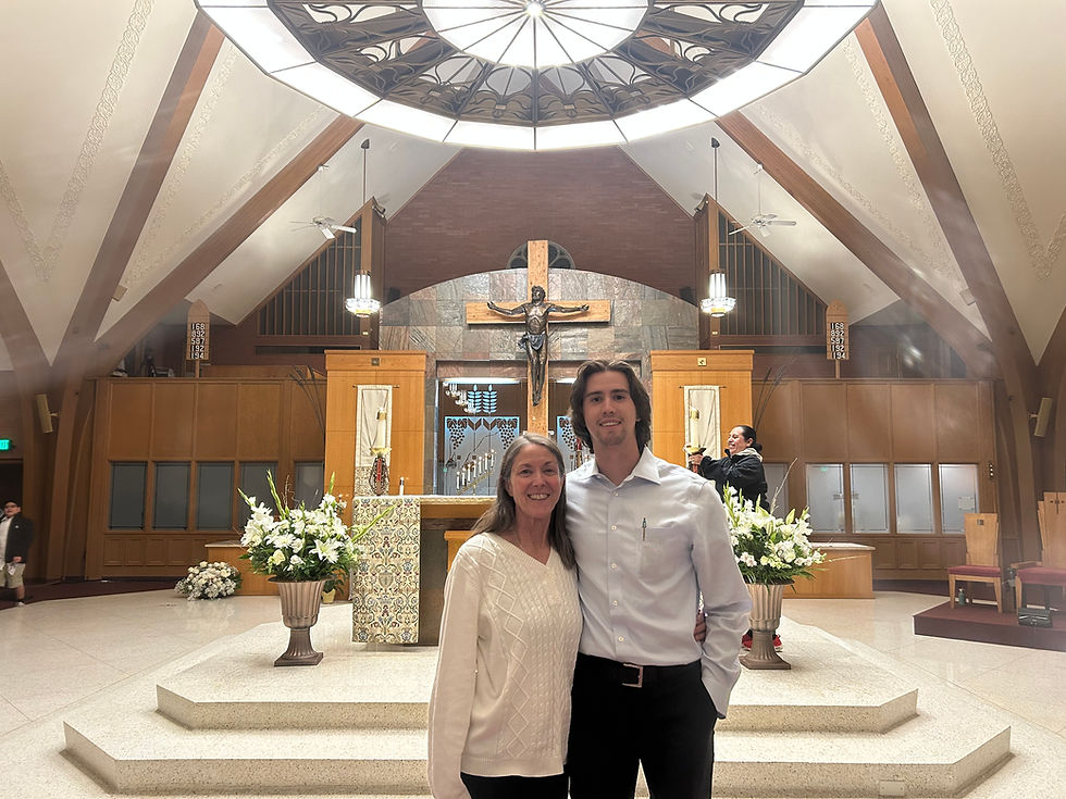 Kathy poses for a picture after the Easter Vigil with her son. Through her process of becoming Catholic, she says she has new hope of transformation and greater freedom for her son and the rest of her family. (Photo provided)
