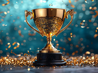 Golden trophy on a dark base surrounded by falling confetti. Background is a blurred teal with a festive, celebratory mood.