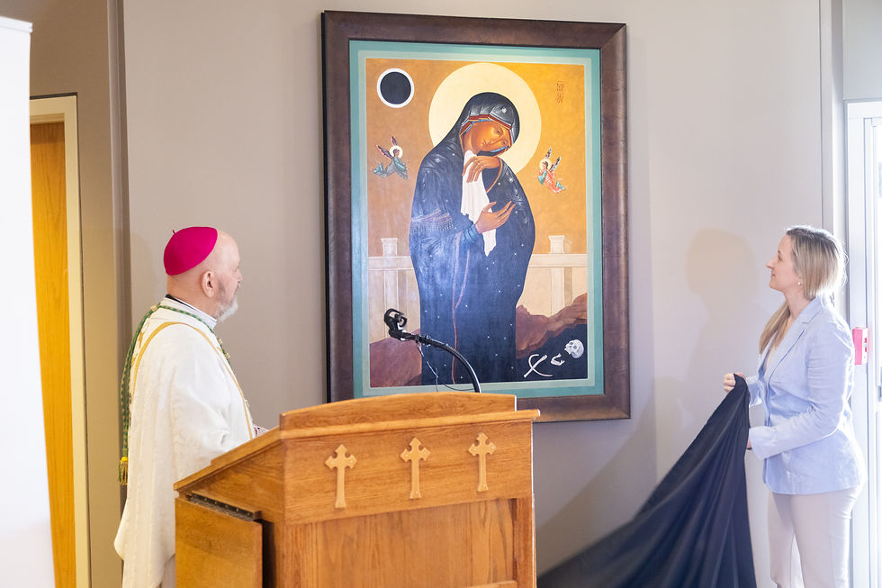 Archbishop Samuel J. Aquila and Elizabeth Zelasko, a local sacred artist and Denver Catholic columnist who wrote the new icon, unveiled "Mary at the Foot of the Cross" in a simple ceremony at the Pastoral Center on Tuesday. (Photo by Denver Catholic Staff)