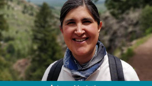 Smiling person with a blue scarf and backpack outdoors, lush green mountain background. Text: "Appeal in Action" at bottom.