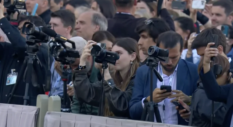 Media crews and photographers capture the historic moment as crowds gather in St. Peter's Square following the appearance of white smoke from the Sistine Chapel after 6 pm local time, signaling the election of a new pope, on May 8, 2025. (Photo: Vatican Media / Screenshot)