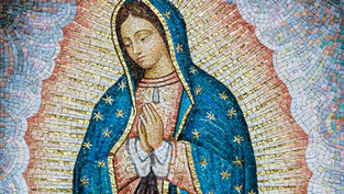 Mosaic of a serene figure with downcast eyes, wearing a blue cloak with gold stars, against a radiant patterned backdrop. Hands clasped in prayer.