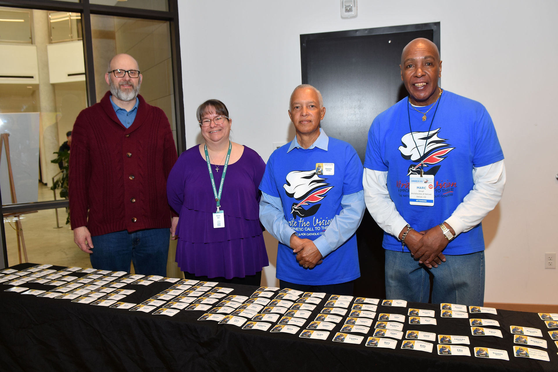 Dwayne Williams & Marc Small lead check-in Cory & Renee Birt. (Photo by James Baca)