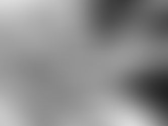 Hands gently holding another's in a comforting gesture. A ribbon is tied around one wrist. Monochrome image conveys warmth and care.
