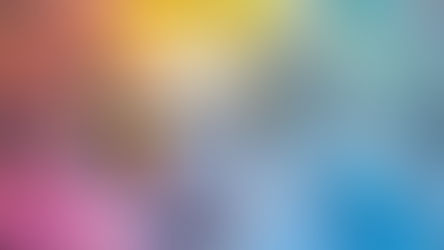 Wooden cross with rainbow stripes on colorful abstract background of blues, yellows, and reds. Vibrant, artistic, and inspiring.