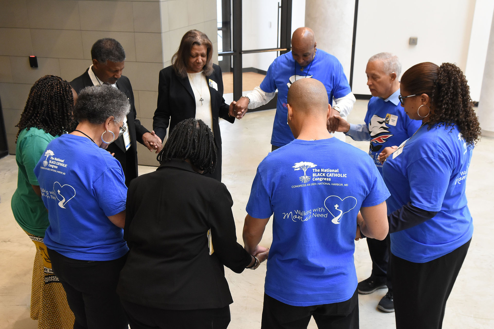 Delegates pray with Sr. Gail Trippett, CSJ, before the conference. (Photo by James Baca)