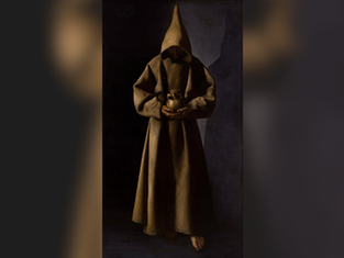 Monk in a hooded brown robe holds a jar, standing barefoot in a dimly lit setting, creating a somber and mysterious mood.