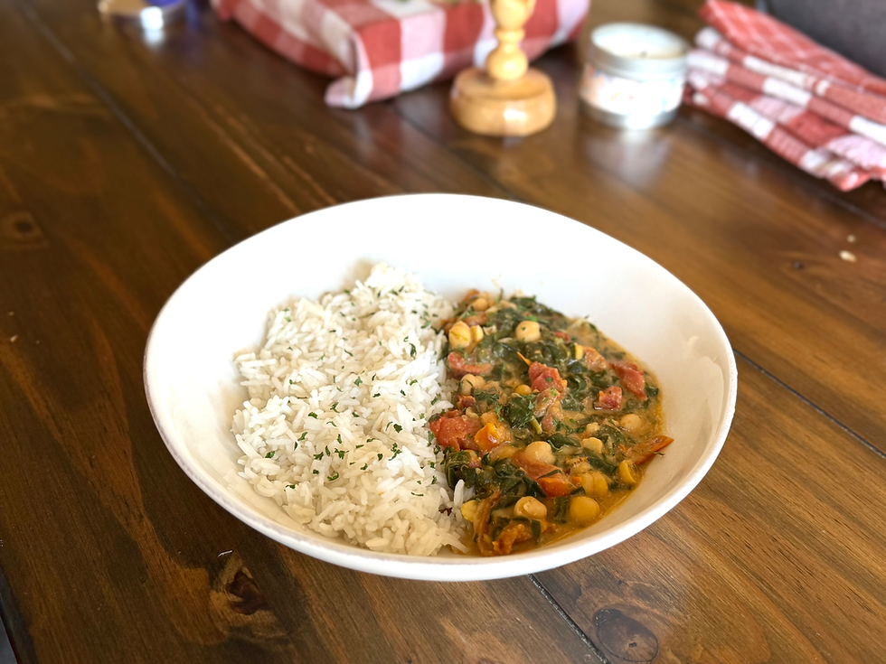 Mediterranean Braised Chickpea Rice Bowl, a Lenten meal served on a family table for Ash Wednesday.
