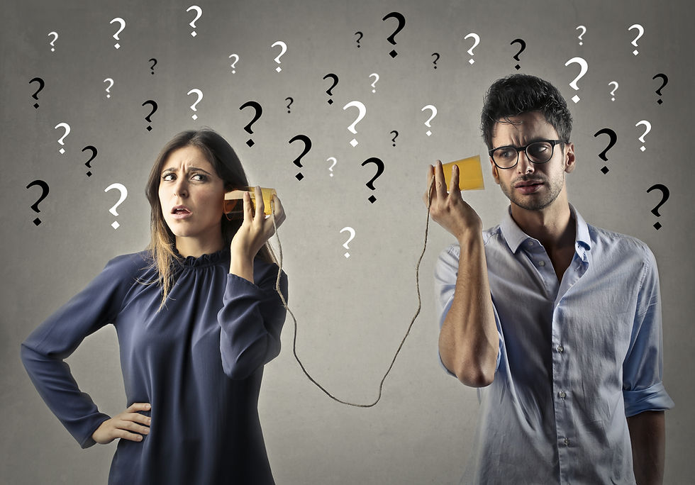 A confused man and woman use tin can phones; question marks fill the gray background, suggesting misunderstanding.