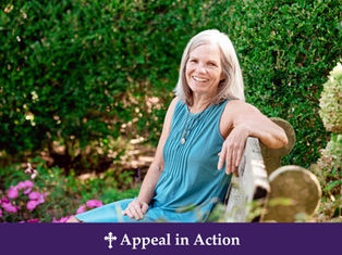 Smiling older woman in teal dress sits on a garden bench, with green hedges and pink flowers; banner reads Appeal in Action.