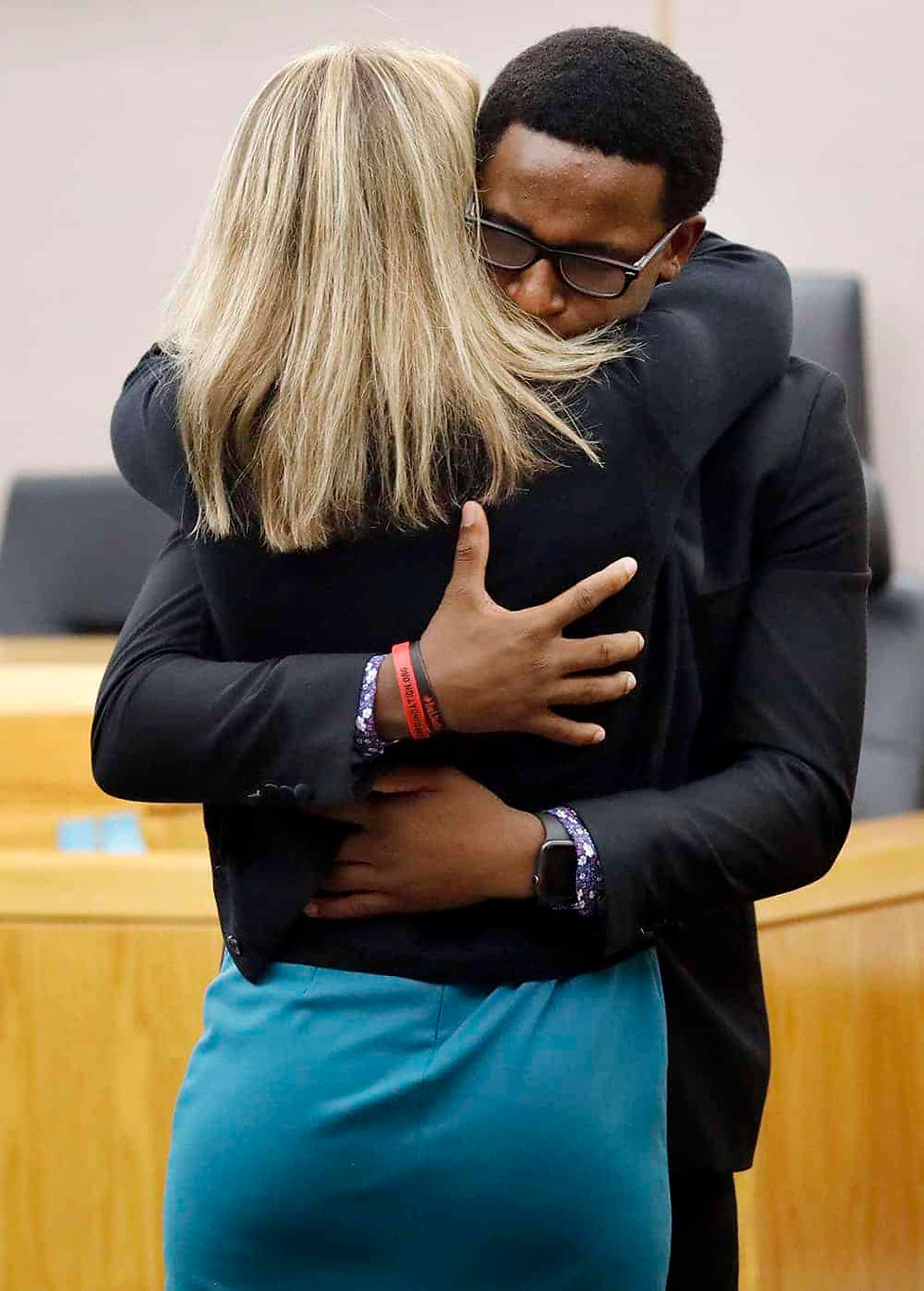 Botham Jean’s younger brother Brandt Jean hugs former Dallas police officer Amber Guyger after delivering his impact statement to her in Dallas, Wednesday, Oct. 2, 2019. Guyger has been sentenced to 10 years in prison for killing her black neighbor in his apartment, which she said she mistook for her own unit one floor below. (Tom Fox/The Dallas Morning News via AP, Pool)