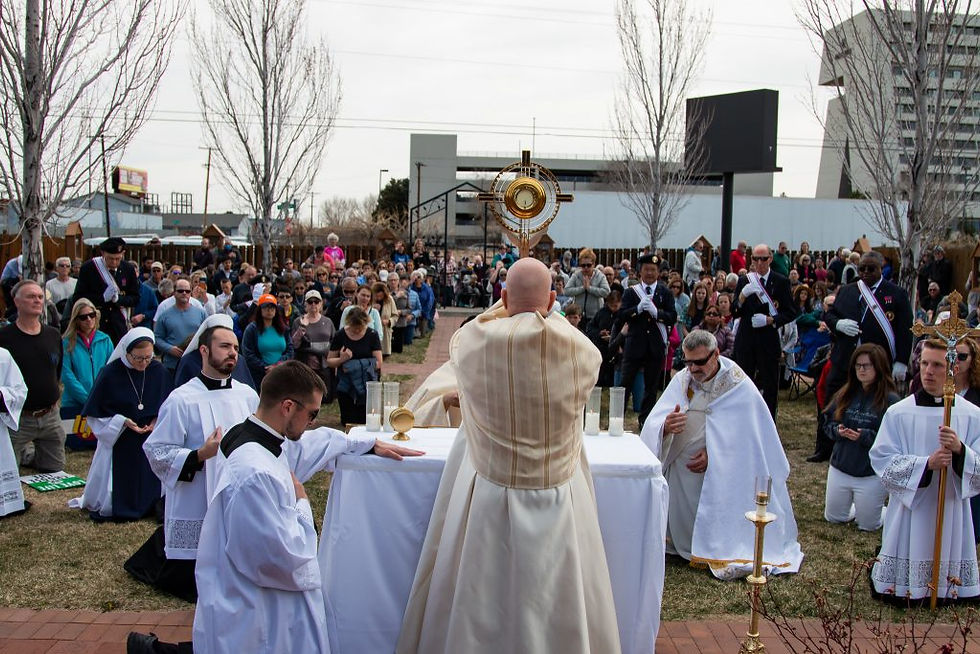 Archbishop Samuel J. Aquila offers benediction, a eucharistic blessing, to all of those present for the pro-life procession around Planned Parenthood. (Photo: André Escaleira, Jr.)