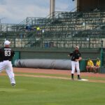 Fr. Nick Thompson throws to Fr. Joe McLagan