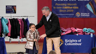 Annunciation student receives golden one millionth coat in Knights of Columbus giveaway