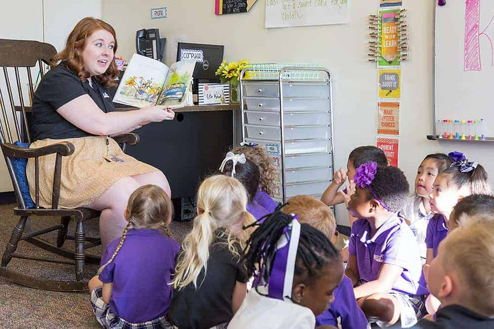 Kindergarten teacher Daniele Buckley reads her students a story on the first day of class. The classical curriculum at Frassati Catholic Academy emphasizes the arts as a means of educating students. (Photo by Jason Weinrich | Denver Catholic)