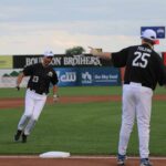 Fr. Darrick Leier rounds the bases
