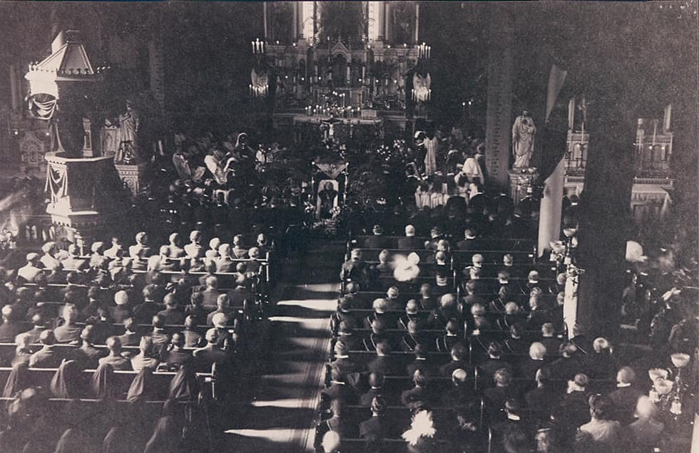 This 1908 file photo from the Denver Catholic Register archives shows a full St. Elizabeth of Hungary Parish for the funeral Mass of Father Leo. Thousands attended, with the majority of attendees likely outside of the church. His body, lying in the open casket, can be seen near the center of the photo. (File photo)