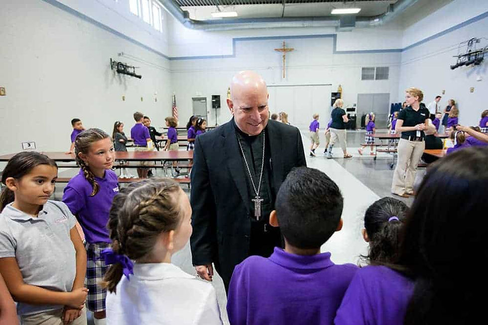 Archbishop Samuel J. Aquila dedicated and blessed the new school building. He explained to the students of Frassati that their school is different because it is a Catholic school, and encouraged each of them to grow in their relationship with Jesus Christ. (Photo by Jason Weinrich | Denver Catholic)