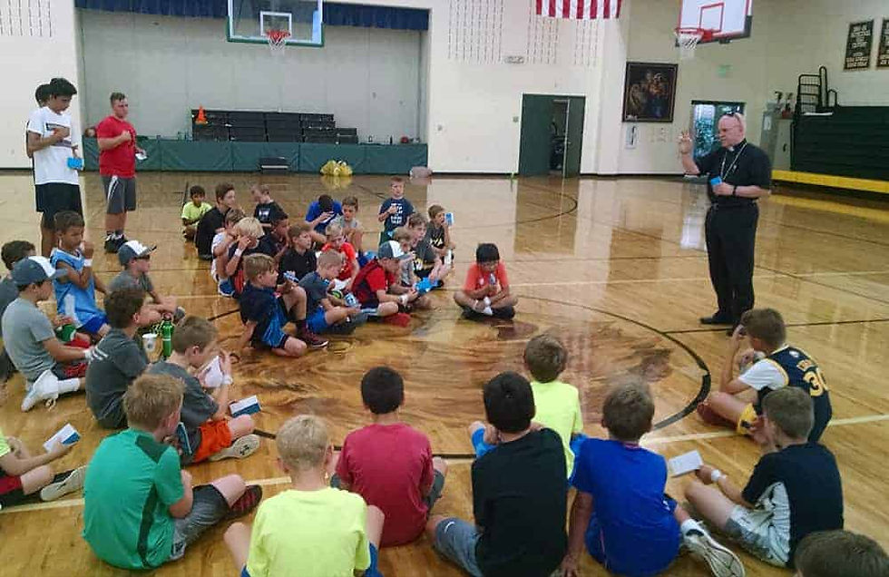 Archbishop Samuel J. Aquila paid a surprise visit to the boys one day during the camp. (Photo provided)