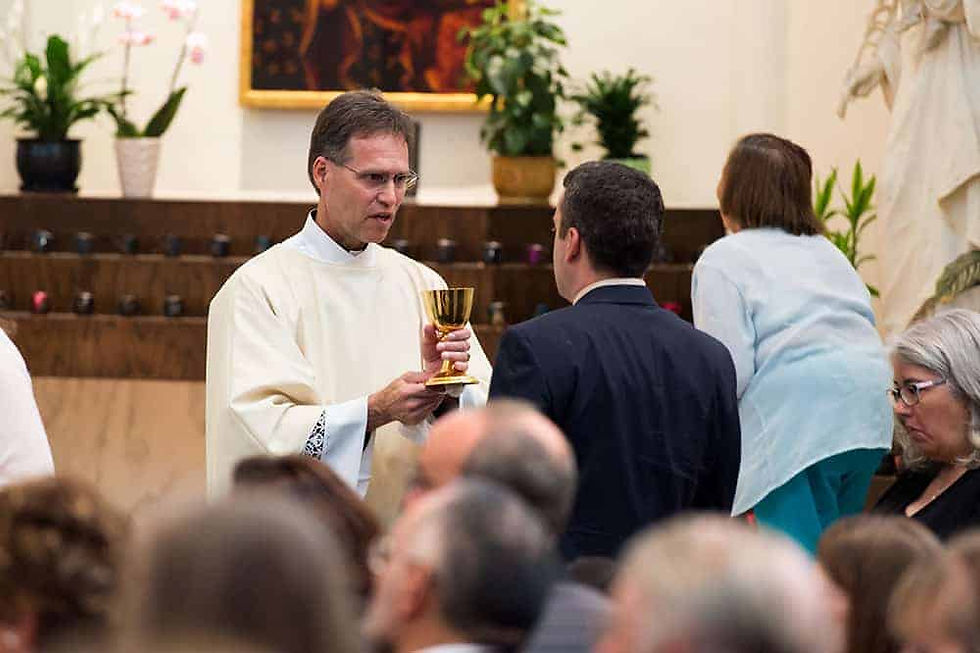 Deacon Robert Hoffman presents the Blood of Christ during Communion at the deacon ordination for the Archdiocese of Denver at the Cathedral Basilica of the Immaculate Conception on June 20, 2015, in Denver, Colorado. (Photos by Anya Semenoff/Denver Catholic)