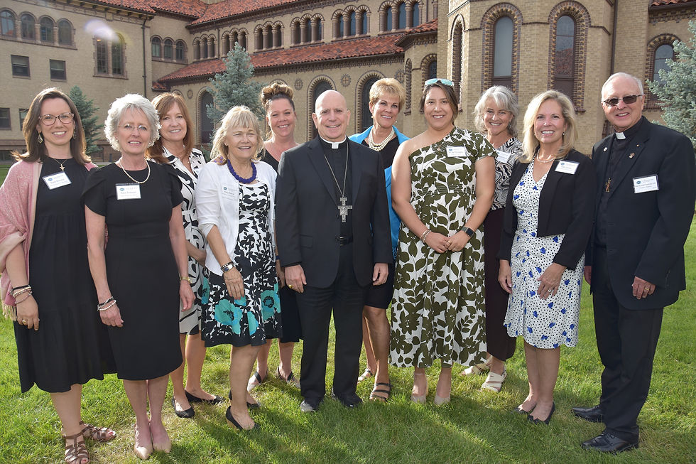 Denver Archbishop Samuel Aquila visits with Emmaus Catholic Hospice staff