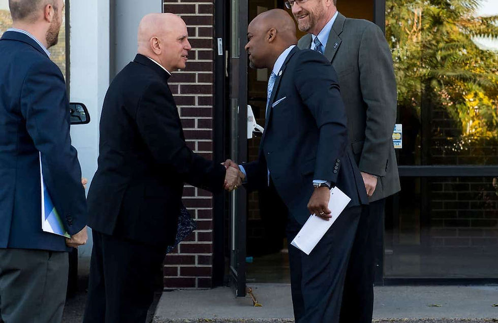Archbishop Samuel J. Aquila and the Archdiocese of Denver have partnered with Mayor Michael Hancock and the City of Denver in the past to better serve people in need, and they’ve continued those collaborative efforts through the coronavirus pandemic. (Photo by Catholic Charities)