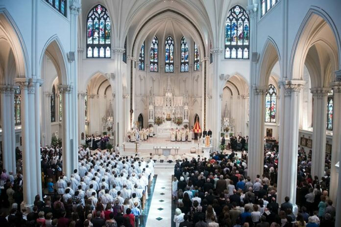 DENVER, CO - MAY 13: Ordinandi lay prostrate during a Mass of Holy Orders for their ordination to the priesthood at the Cathedral Basilica of the Immaculate Conception on May 13, 2017, in Denver, Colorado. (Photo by Daniel Petty/for Denver Catholic)