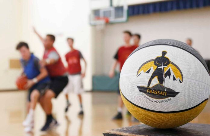 DENVER, CO, July 28, 2017: Ryan O' Connor leads Frassati Sports Camp at Our Lady of Lourdes Parish. The camp runs during the summer and teaches kids discipleship through basketball and other sports. (Aaron Lambert/Denver Catholic)