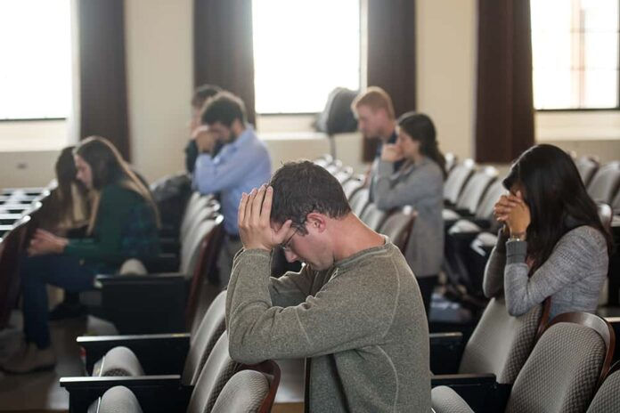 DENVER, CO - OCTOBER 24: Students participate in Mass celebrated by Fr. Angel Perez (not pictured) for the Catholic Medical Association at the Bushnell Auditorium on the Anschutz Medical Campus on October 24, 2017, in Denver, Colorado. (Photos by Anya Semenoff/Denver Catholic)