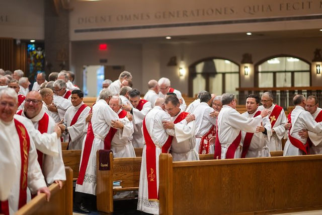 Deacons offer one another the sign of peace during a Deacon Day Mass at Immaculate Heart of Mary Catholic Parish on August 10, 2023, in Northglenn, Colorado. (Photo by Daniel Petty/Denver Catholic)