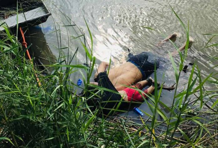 View of the bodies of Salvadoran migrant Oscar Martinez Ramirez and his daughter, who drowned while trying to cross the Rio Grande -on their way to the US- in Matamoros, state of Tamaulipas on June 24, 2019. - Twenty-five-year-old Oscar Martinez Ramirez fled El Salvador with his 21-year-old wife and their daughter and decided to make the risky crossing from Mexico to the US on Sunday afternoon, according to a Mexican court report seen by AFP. Ramirez carried the little girl on his back, stowing her inside his t-shirt to keep her safe as they attempted to cross the river. But the pair were swept away by violent currents, drowning before her mother's eyes, who survived the ordeal and arrived on shore. (Photo by STR / AFP) / The erroneous mention[s] appearing in the metadata of this photo by STR has been modified in AFP systems in the following manner: [state of Tamaulipas] instead of [state of Coahuila]. Please immediately remove the erroneous mention[s] from all your online services and delete it (them) from your servers. If you have been authorized by AFP to distribute it (them) to third parties, please ensure that the same actions are carried out by them. Failure to promptly comply with these instructions will entail liability on your part for any continued or post notification usage. Therefore we thank you very much for all your attention and prompt action. We are sorry for the inconvenience this notification may cause and remain at your disposal for any further information you may require. (Photo credit should read STR/AFP/Getty Images)