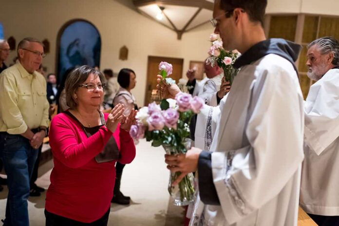 LITTLETON, CO - OCTOBER 3: Members of the secular order of Carmelites receive flowers following Mass at the Carmelite Monastery on October 3, 2017, in Littleton, Colorado. (Photo by Daniel Petty/Denver Catholic)