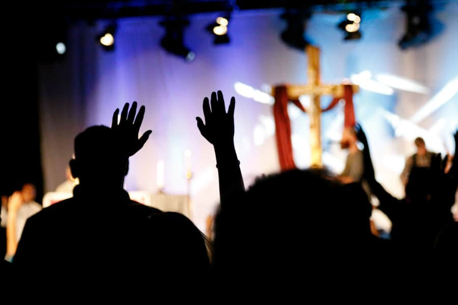 DENVER, CO, June 25, 2016 - Many youth lost themselves during adoration and lifted their hands in worship. After the music had ceased, the congregation continued to softly chant prayers.